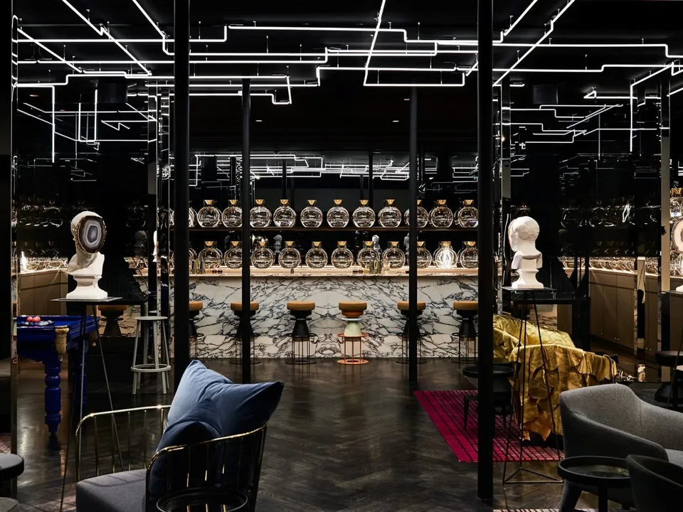 Flaggerdoot cocktail bar with marble counter, neon-lit ceiling, and electric blue pool table