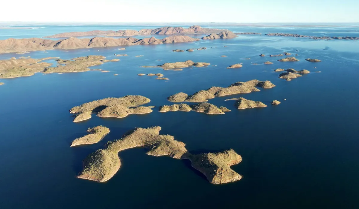 Aerial view of Kimberley coastline with turquoise water and red rock islands