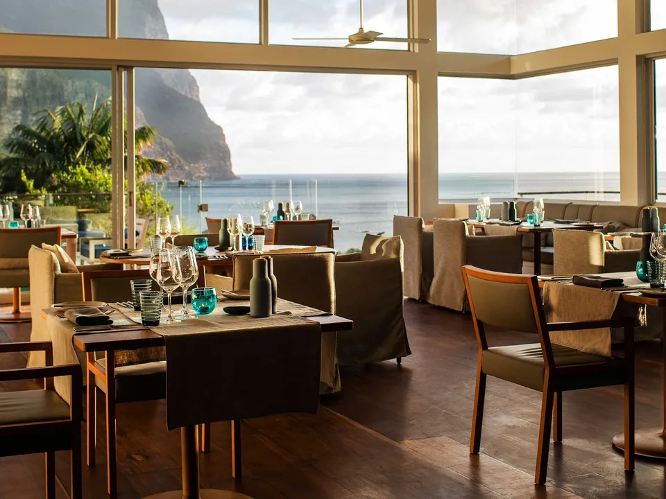 Capella Restaurant with floor-to-ceiling mountain and ocean views
