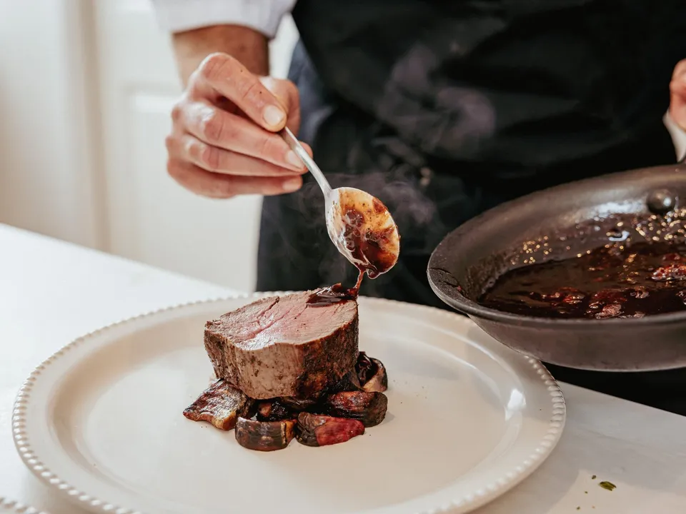 Private chef preparing locally sourced cuisine