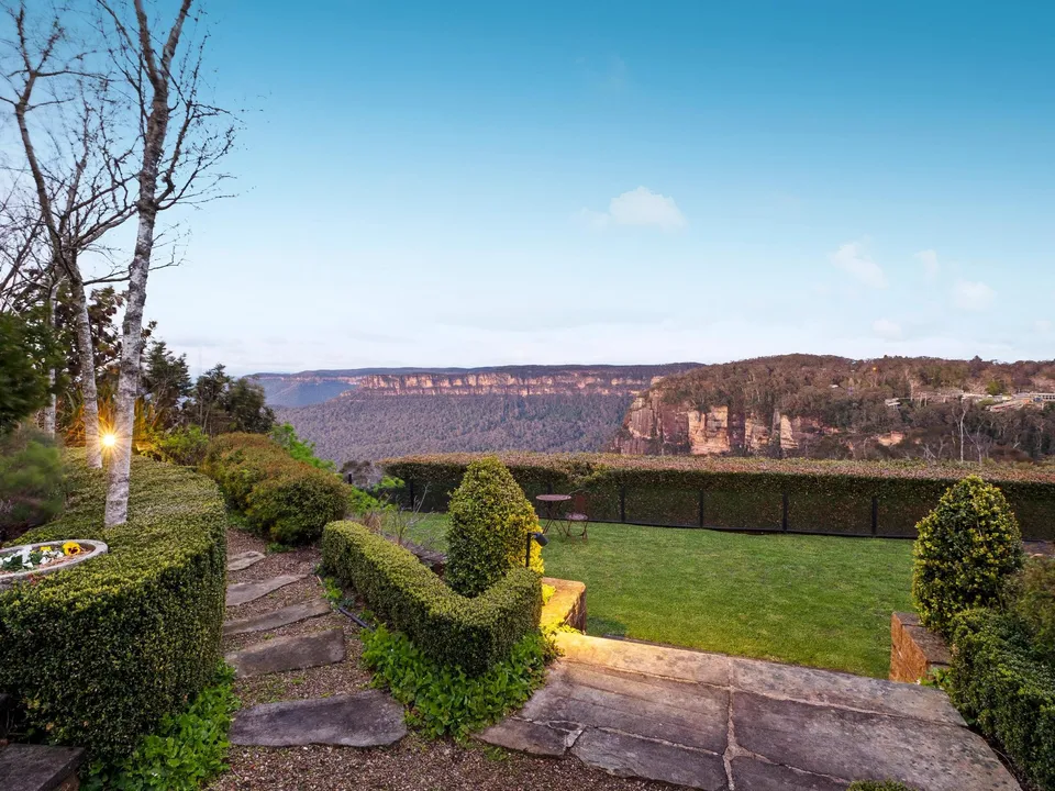 Cliff-top garden steps with valley views