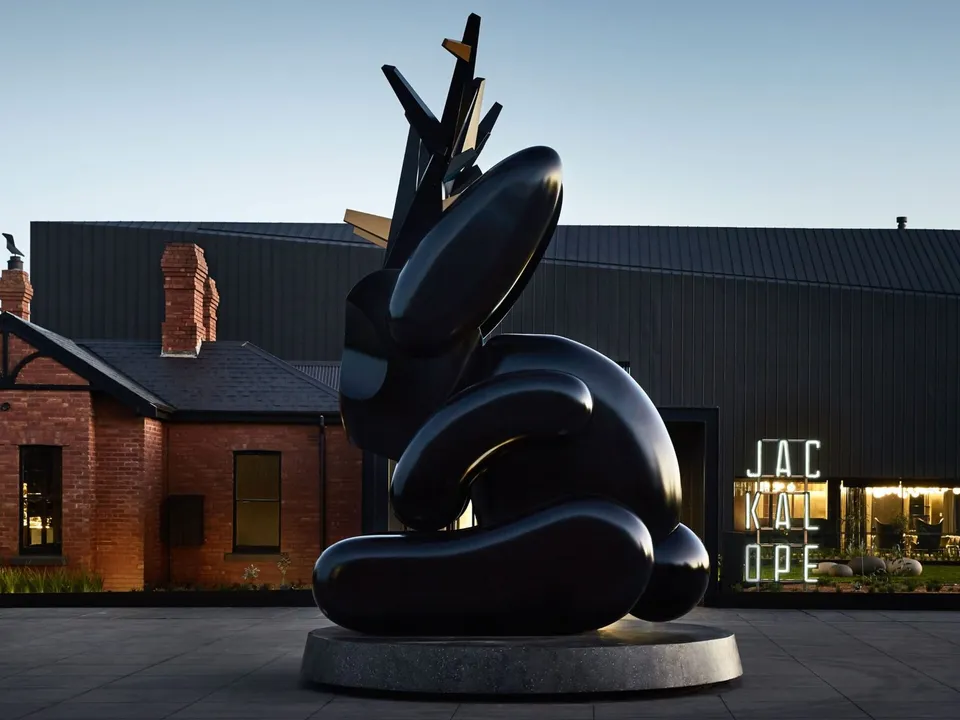 The 7-metre Emily Floyd Jackalope sculpture guards the entrance, flanked by the heritage McCormick House and charred timber hotel wing