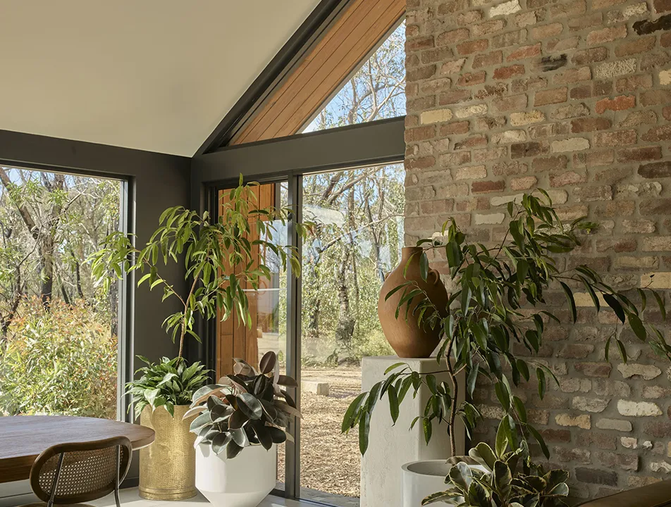 The Library lounge with exposed brick and floor-to-ceiling windows