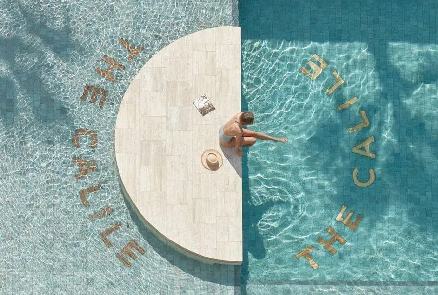 The iconic 30-metre pool with gold-tiled lettering