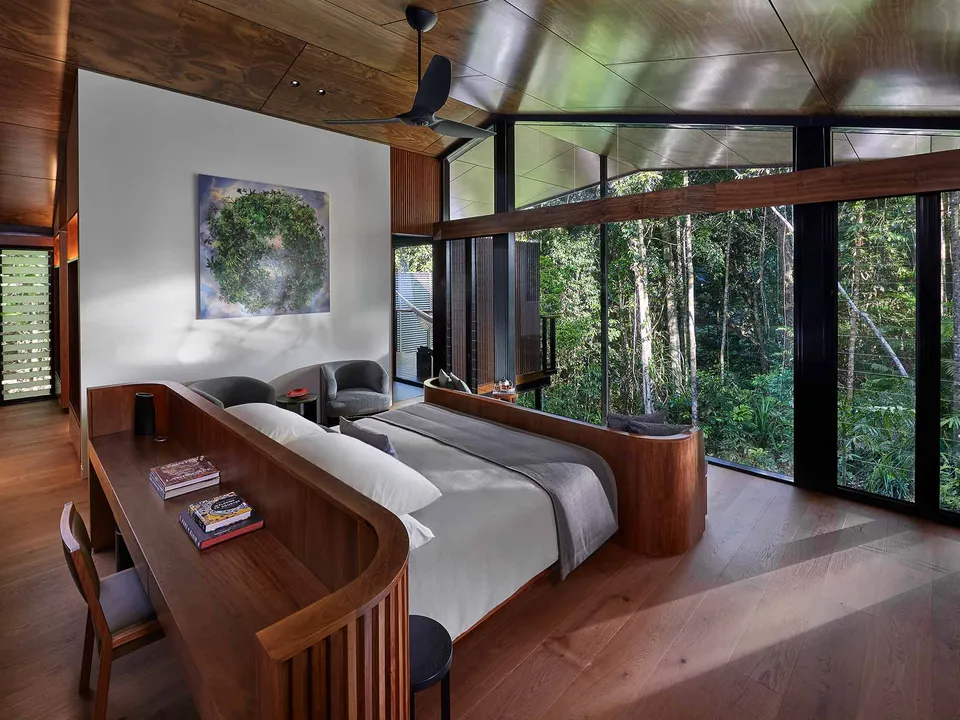 A Treehouse Retreat with outdoor stone bathtub among the treetops