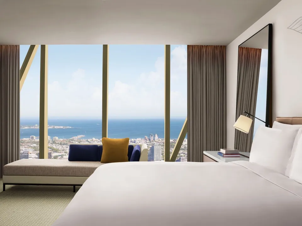 King Room with Bay Views featuring floor-to-ceiling windows and Port Phillip Bay panorama