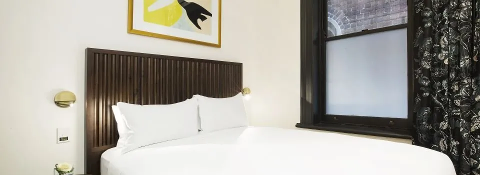 Cosy room with curated artwork and heritage window