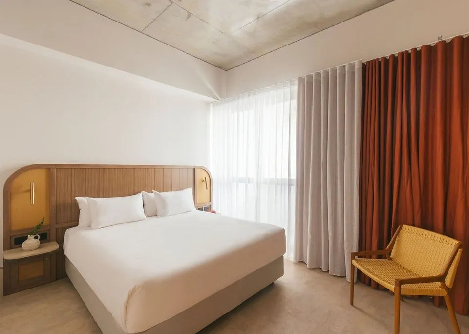 Guest Room with warm coastal interiors