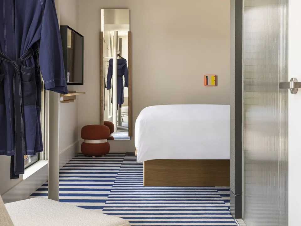 Suite Spot bedroom with signature king bed and city views