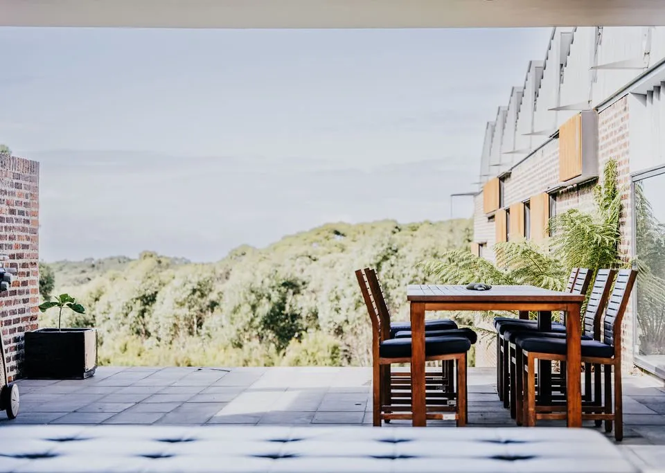 Outdoor dining with hinterland views
