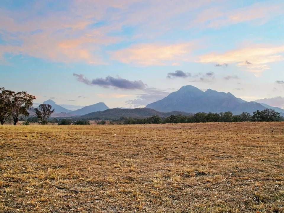 Sunset across the fields towards Mount Barney